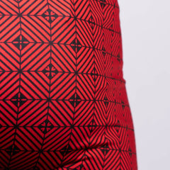 Kaleidoscope sq cut trunk in red fabric with bold black geometric interlocking diamonds and cross motifs pattern