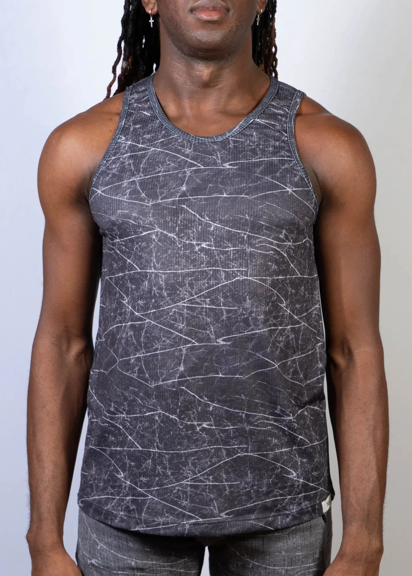 Dark gray tank top with white crackle lightning print pattern across the fabric for casual wear