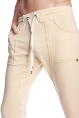 Beige corduroy long cuffed jogger and yoga sweat pants with white drawstring and side pockets