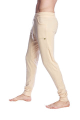 Beige long cuffed jogger and yoga sweat pants with drawstring waistband and elastic cuffs for comfort and style