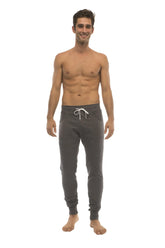 Long cuffed jogger and yoga sweat pants in charcoal with white drawstring waistband and elastic cuffs