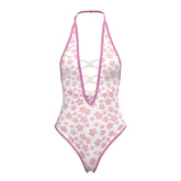 Magic silk teddy snap crotch one-piece swimsuit in white with pink floral pattern halter neckline and lace-up front