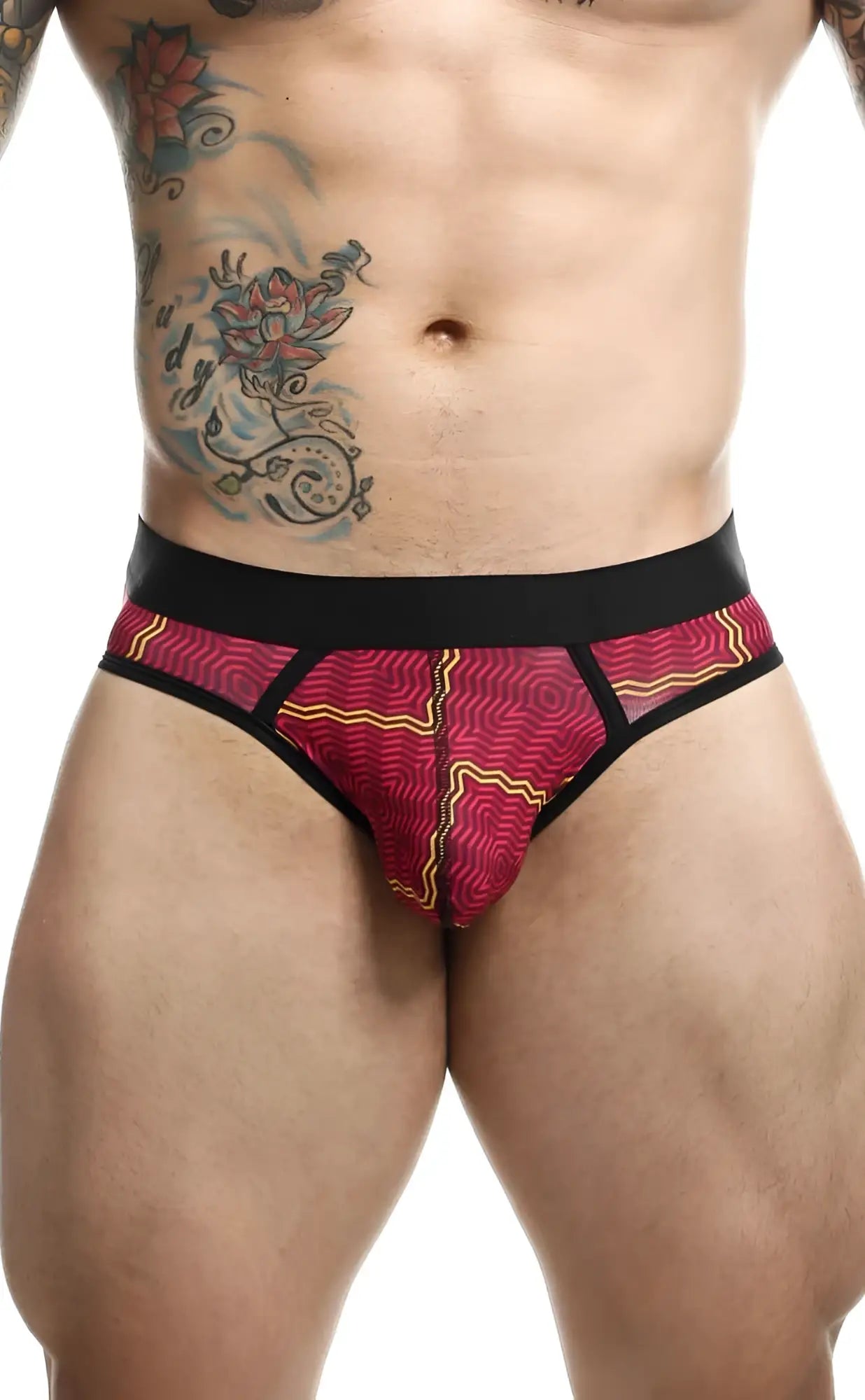 Malebasics brief sexy pouch in vibrant red and yellow patterned fabric with black trim for a bold look