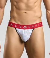 Malebasics spot jockstrap in white mesh briefs with red waistband and male basics logo with white cross symbol
