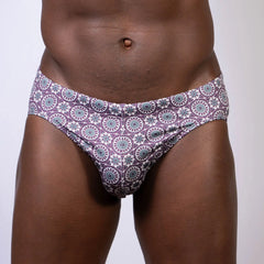 Mandala swim brief purple and teal geometric floral patterned briefs front view designed for swimwear use