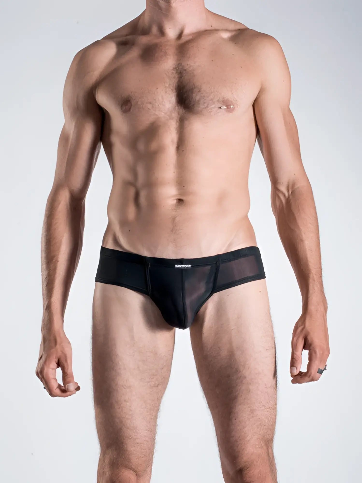 Black mesh cheeky briefs with solid black waistband by MANstore in size S visible from the front side
