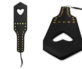 Black leather paddle with gold-colored studs and heart-shaped cutout from mapale 998 spanker color black