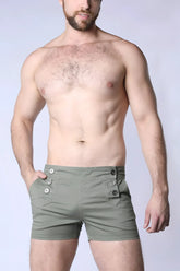 Olive green mariner sailor shorts with buttoned flap pockets and tailored fit made from durable fabric