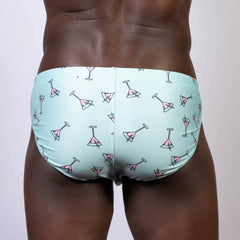 Light blue martini swim brief with a pink martini glass pattern perfect for beach and pool wear