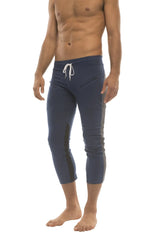 Mens 4/5 zipper pocket capri yoga pants in navy blue with white drawstring waistband and black side panels