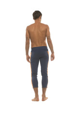 Navy blue mens capri yoga pants with orange side stripes and 4/5 zipper pockets for activewear use