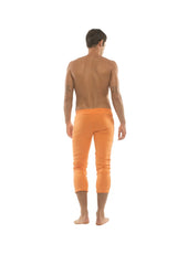 Mens solid orange 4/5 zipper pocket capri yoga pants made from breathable fabric for activewear use