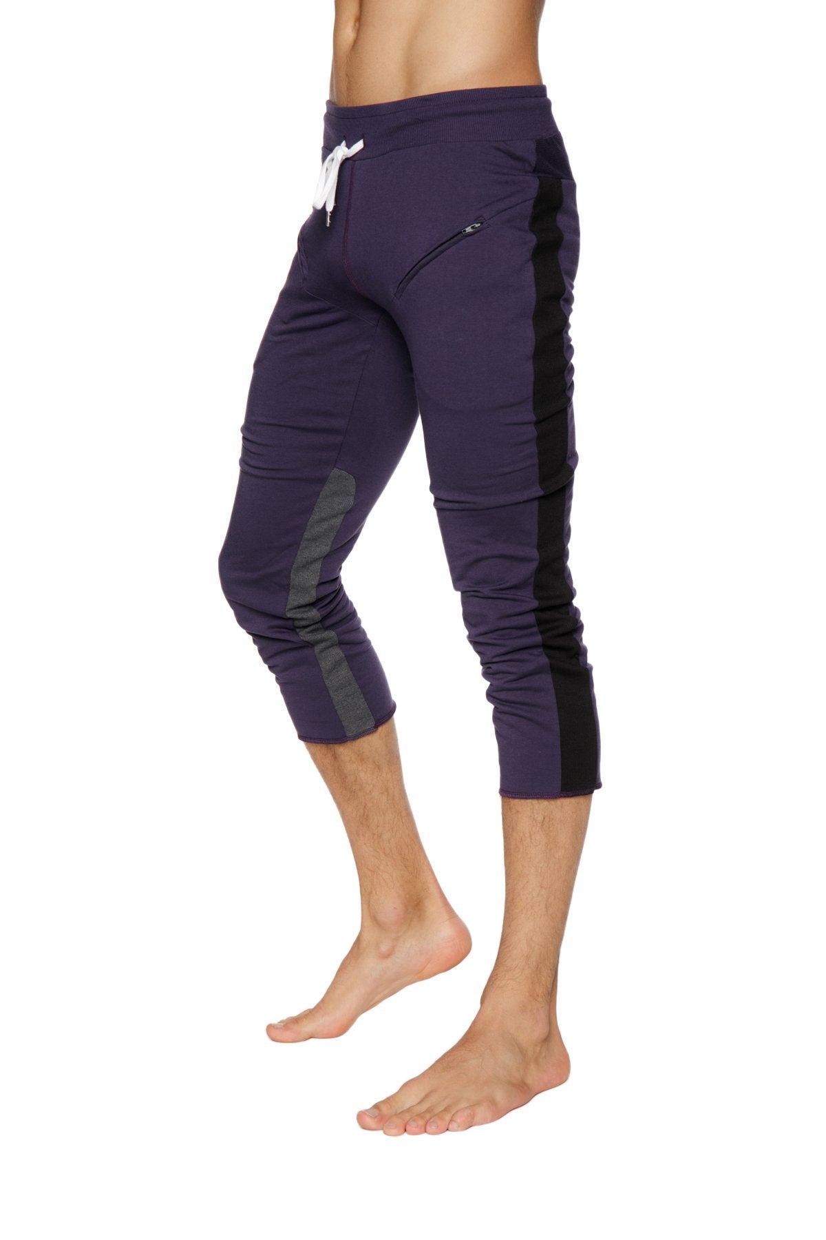 Mens 4/5 zipper pocket capri yoga pants in dark purple with black side panels and white drawstring waistband