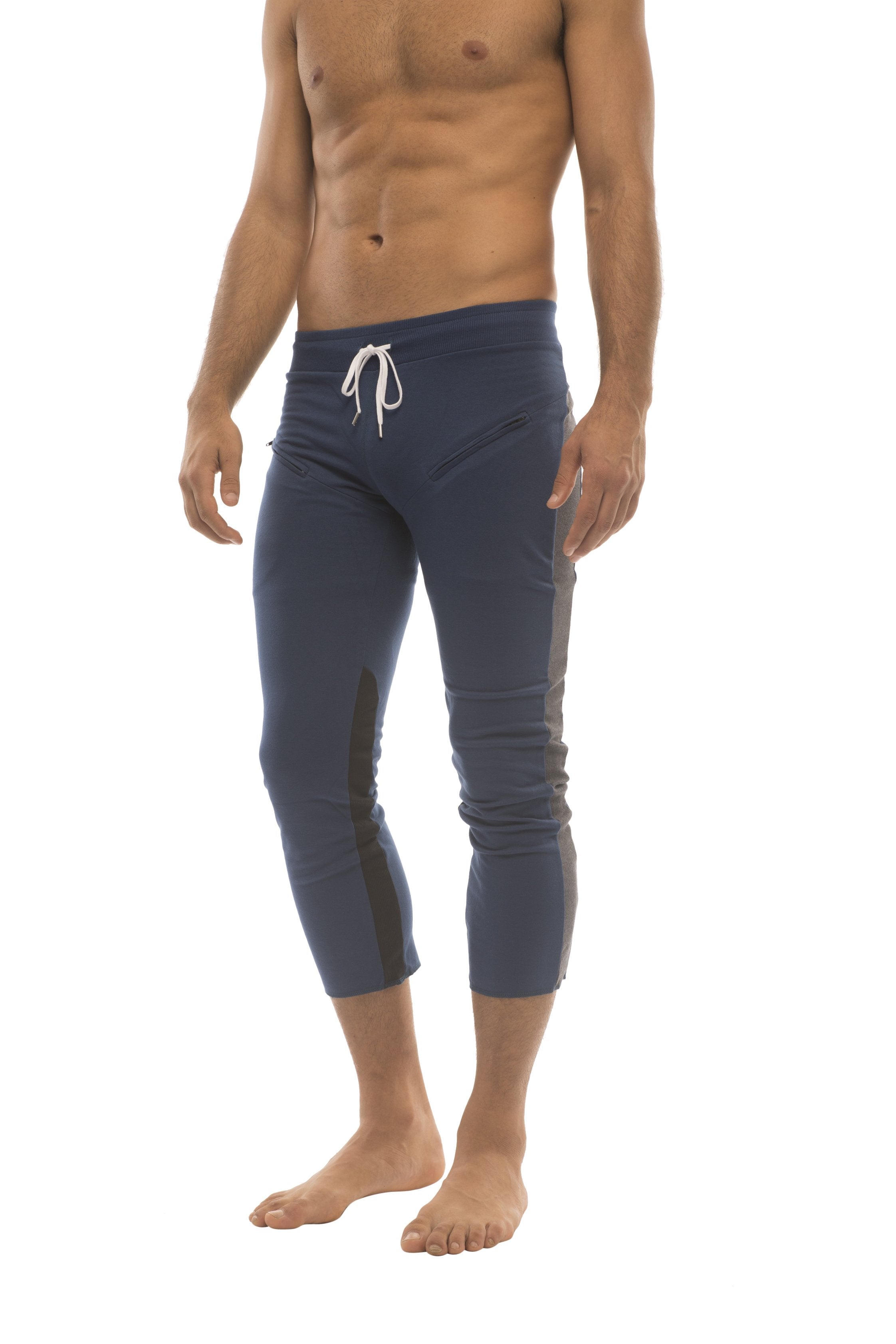 Mens 4/5 zipper pocket capri yoga pants in navy blue with white drawstring waistband and black side panels