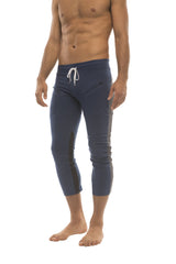 Mens 4/5 zipper pocket capri yoga pants in navy blue with white drawstring waistband and black side panels