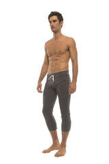 Mens solid charcoal dark gray capri-length yoga pants with white drawstring waistband and zipper pockets