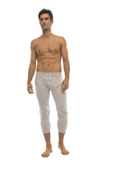 Mens solid heather grey capri yoga pants with drawstring waist and side zipper pockets in light gray material