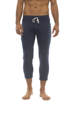 Mens navy blue capri yoga pants with white drawstring waistband and 4/5 zipper pockets for athletic use