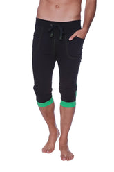Mens cuffed black yoga capri pants with green trim on cuffs and pockets and a drawstring waistband