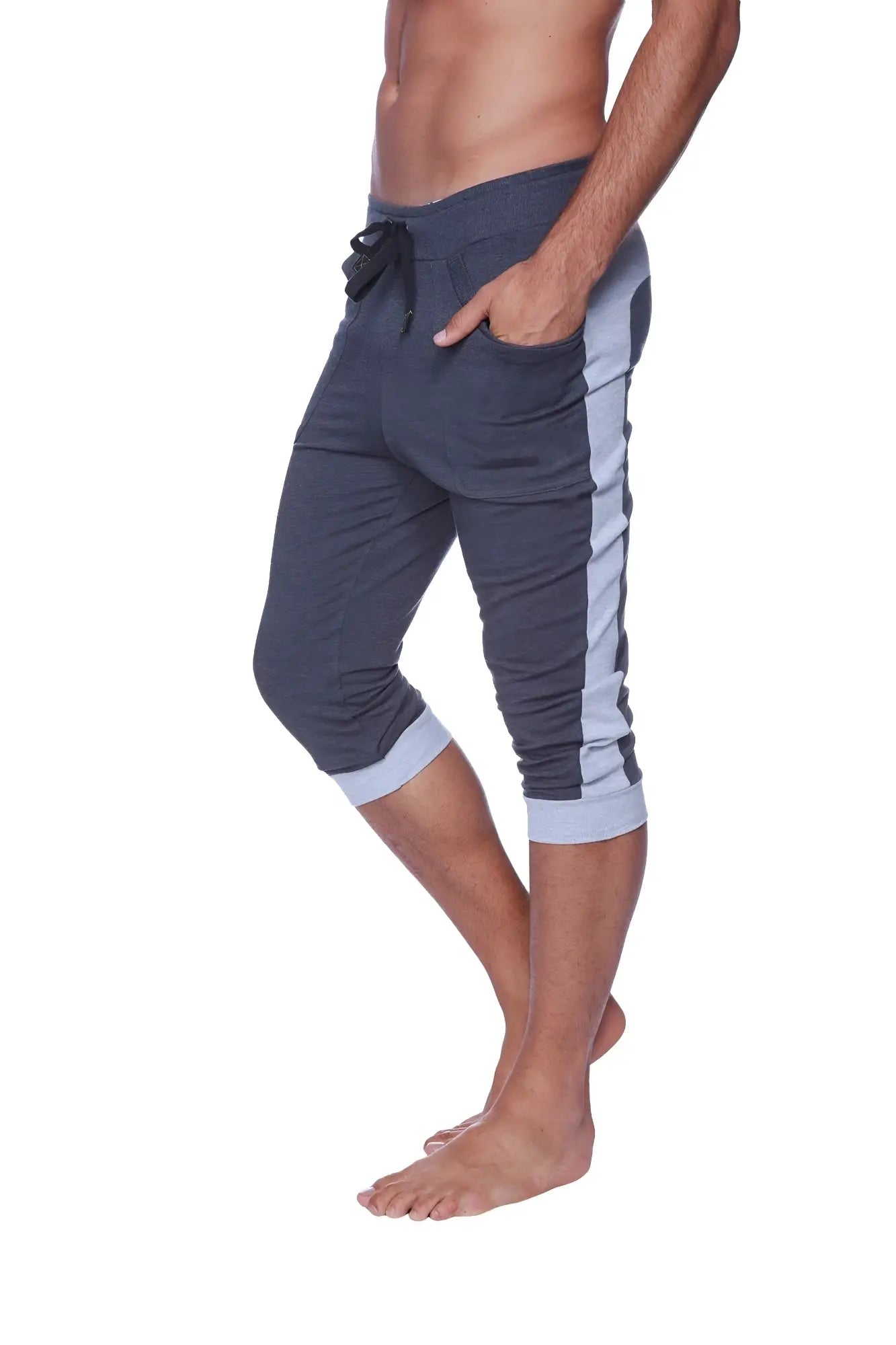 Dark gray cuffed yoga pants with light blue side stripes and ribbed cuffs in capri-length for men
