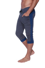 Mens cuffed yoga pants in charcoal with royal blue featuring a drawstring waistband side pockets and ribbed cuffs