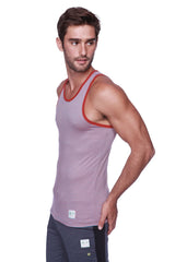 Men’s light purple tank top with thin red stripes and red trim paired with charcoal cuffed yoga pants with black accents