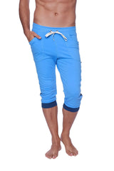 Mens cuffed yoga pants in bright blue with navy cuffs and white drawstring waistband for comfortable wear