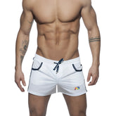 White mesh athletic shorts with navy blue drawstring and trim featuring a colorful logo on the lower right leg