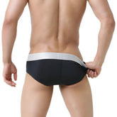 MetroMaleWear Basico Brief black swim trunks with sleek silver waistband designed for comfortable water use