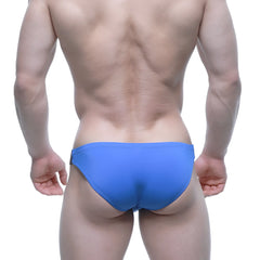 Bright blue metroMalewear BEATNIK bikini swim trunks with a sleek form-fitting design ideal for beachwear