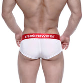 White briefs with a red waistband featuring the metrewear logo in white from MetroMaleWear Benjamin Mini Cheek Boxer 2025-02