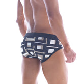 MetroMaleWear black swim brief 4916-33 featuring bold white and beige geometric pattern for stylish beachwear