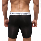 Black sheer athletic briefs with white waistband featuring gray stripes and nin logo from MetroMaleWear Bosillo Bold Long Boxer