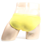 Bright yellow metroMalewear bravo bikini briefs displayed on a mannequin showcasing vibrant color and snug fit