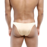 Beige form-fitting seamless briefs with subtle sheen metro male wear bulge capri bikini gold 6104-21