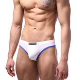 White briefs with blue trim and black brand label from MetroMaleWear Caldero Thong white 1202-00 product line