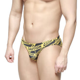 MetroMaleWear caution bikini black 5103-m61 men’s swim trunks with yellow and black caution tape pattern for swimming