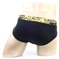 Black swim trunks with a bold yellow caution tape waistband from MetroMaleWear caution brief 5203-60
