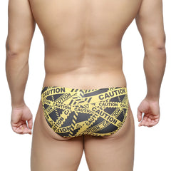 Metro malewear caution lowrise bikini swim trunks in yellow and black caution tape pattern for bold beachwear