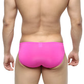 Bright pink form-fitting swim trunks with smooth stretchy fabric from metromalewear cesar bikini magenta 6009-02