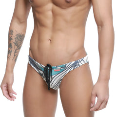 MetroMaleWear classic men’s swim trunks with bold teal black and white tropical leaf pattern and black drawstring