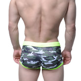 Men’s MetroMaleWear classic swim trunk camo green briefs with neon green waistband and trim in front view