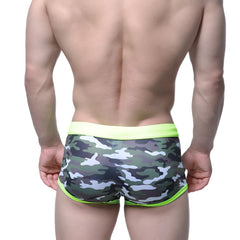 Men’s MetroMaleWear classic swim trunk camo green briefs with neon green waistband and trim in front view