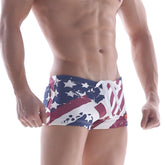 MetroMalewear cotton swim trunks in patriot red with a distressed American flag design in red white and blue