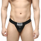 Black leather-like MetroMaleWear Deseo thong metal black 3312-30 with white rectangular logo patch on waistband