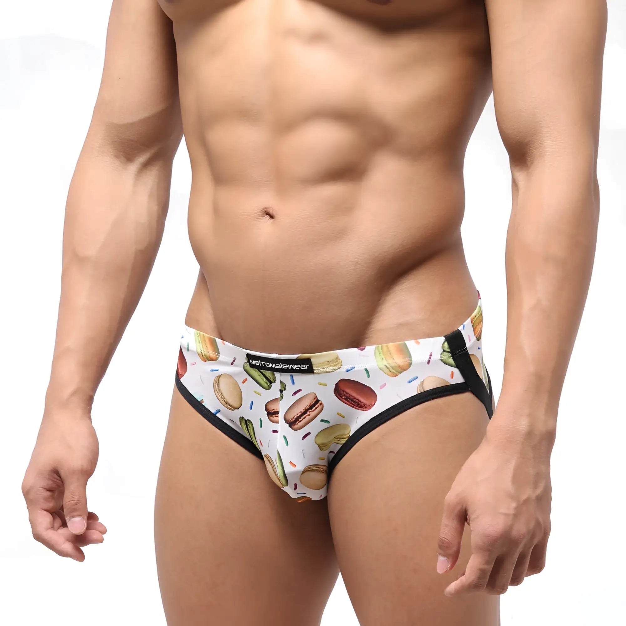 White men’s briefs by MetroMaleWear featuring a playful macaron hot dog and candy sprinkle pattern with black trim