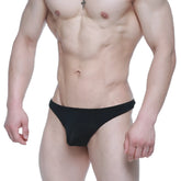 Metro male wear dream thong black 2002-21 sleek black form-fitting swim trunks with smooth fabric finish front view