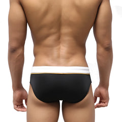 MetroMaleWear Edge swim brief in black with a white waistband and thin gold trim designed for swimming