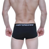 Black metro malewear elemental boxer briefs featuring a white logo waistband designed for comfort and support