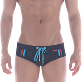 MetroMaleWear Europa swim brief black with vibrant blue and red side stripes and light blue drawstring front bow